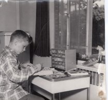 Arden Shore boy working on a stamp book